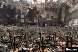 The auditorium of Eliot Arts Magnet Middle School lies in ruins after wildfires swept through Altadena, California, Jan. 9, 2025.