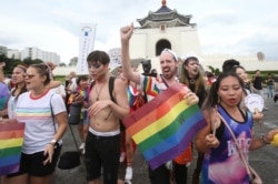 Participants march during the "Taiwan Pride March for the World!" at Liberty Square at the CKS Memorial Hall in Taipei, Taiwan, June 28, 2020.