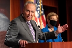 Senate Minority Leader Sen. Chuck Schumer of N.Y., left, with Sen. Elizabeth Warren, D-Mass., speaks during a news conference, Sept. 9, 2020, on Capitol Hill in Washington.