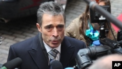 NATO Secretary General Anders Fogh Rasmussen answers questions by journalists, prior to the start of the EU foreign and defense ministers meeting at the European Council building in Brussels, November 19, 2012.