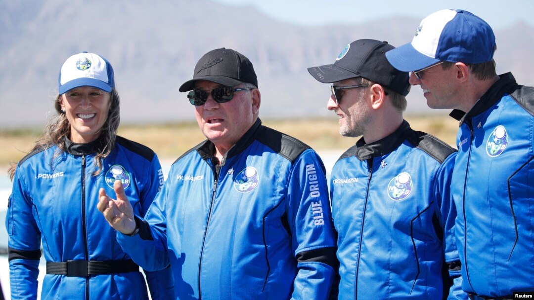 "Star Trek" actor William Shatner, 2nd left, speaks to the news media with the three other crew members after their flight in a capsule powered by Blue Origin's reusable rocket engine New Shepard, on a landing pad near Van Horn, Texas, October 13, 2021.