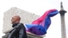 Ed Willcox, a participant in the artwork of the sculpture 'Mil Veces un Instante' (A Thousand Times in an Instant)' by Teresa Margolles, poses for a photo after it was unveiled on Trafalgar Square's Fourth Plinth in London, Britain, Sept. 18, 2024. 