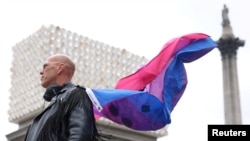 Ed Willcox, a participant in the artwork of the sculpture 'Mil Veces un Instante' (A Thousand Times in an Instant)' by Teresa Margolles, poses for a photo after it was unveiled on Trafalgar Square's Fourth Plinth in London, Britain, Sept. 18, 2024. 