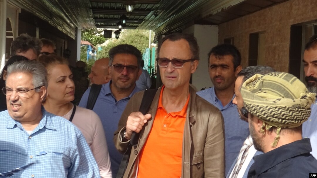 Retired Dutch Gen. Patrick Cammaert, center, who is leading a joint committee tasked with overseeing a truce in the port city and the withdrawal of both parties, arrives at the Yemeni port of Hodeidah, Jan. 13, 2019. 