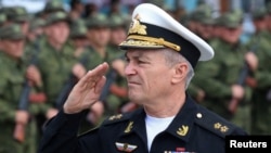 FILE - Commander of the Russian Black Sea Fleet Vice-Admiral Viktor Sokolov salutes during a send-off ceremony for reservists drafted during partial mobilization, in Sevastopol, Crimea, Sept. 27, 2022. 