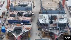 FILE - Ships are seen under construction at a shipbuilding facility at the port in Taicang, in China’s eastern Jiangsu province on Feb. 19, 2025.