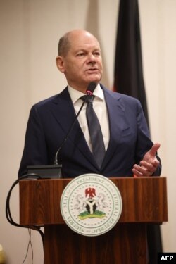 FILE - German Chancellor Olaf Scholz answers questions from the audience after a bilateral meeting with Nigeria’s President in Abuja on October 29, 2023.