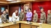 FILE - Chinese actor Wang Xing, third from left, shakes hands with a Thai police officer following his return after being kidnapped into a Myanmar telecom fraud center, at a police station in the Mae Sot district, Thailand, on Jan. 7, 2025. (Royal Thai Police via Reuters)