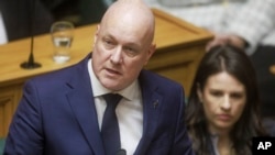 New Zealand's Prime Minister Christopher Luxon makes a "formal and unreserved" apology in Parliament for the abuse, torture and neglect of hundreds of thousands of children and vulnerable adults in care, in Wellington, New Zealand, Nov. 12, 2024.