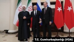 Dari kiri: Presiden Iran Hassan Rouhani , Presiden Rusia Vladimir Putin, dan Presiden Turki Recep Tayyip Erdogan dalam pertemuan membahas masa depan Suriah di kota resor Sochi, Rusia, Kamis (14/2). 