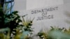 FILE - A sign marks an entrance to the Robert F. Kennedy Department of Justice Building in Washington, Jan. 23, 2023.