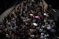 Anti-government protesters march at Central district in Hong Kong, Oct. 2, 2019.