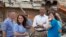 President Barack Obama views the devastation at Plaza Towers Elementary School caused by tornado and severe weather last week with school officials, May 26, 2013, in Moore, Oklahoma.