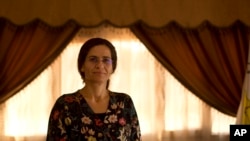 FILE - Ilham Ahmed, co-chair of the executive committee of the U.S-backed Syrian Democratic Council, speaks during an interview in Darbasiyah, Syria, Sept. 3, 2019.