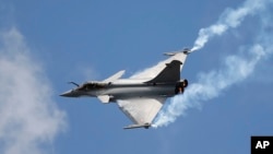 FILE - A Rafale fighter jet is seen during a demonstration flight at the Paris Air Show, in Le Bourget, north of Paris, June 19, 2015. India on Friday signed a $8.7 billion deal with France to buy 36 of them.