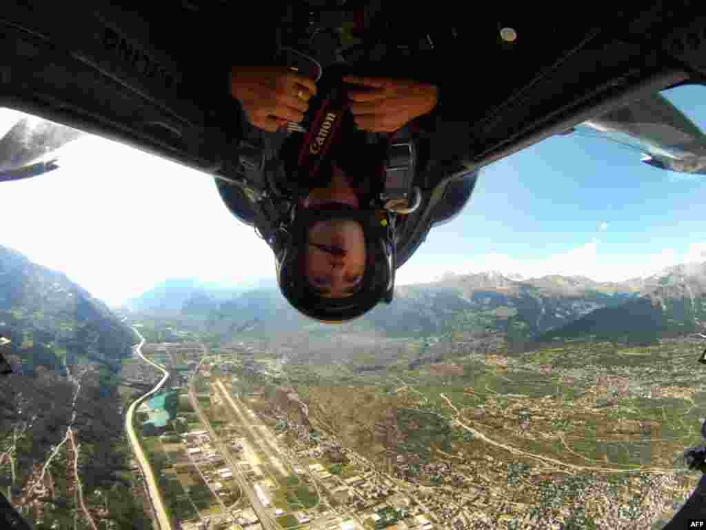 September 14: Reuters photographer Denis Balibouse takes pictures in the L-39 C Albatros aircraft during a presentation flight of the Breitling Jet Team in Sion, Switzerland. REUTERS/Denis Balibouse