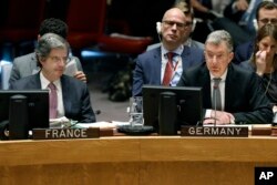 FILE - Germany's U.N. Ambassador Christoph Heusgen, right, addresses the United Nations Security Council, as France's U.N. Ambassador Francois Delattre, left, listens, at U.N. headquarters, Jan. 22, 2019.