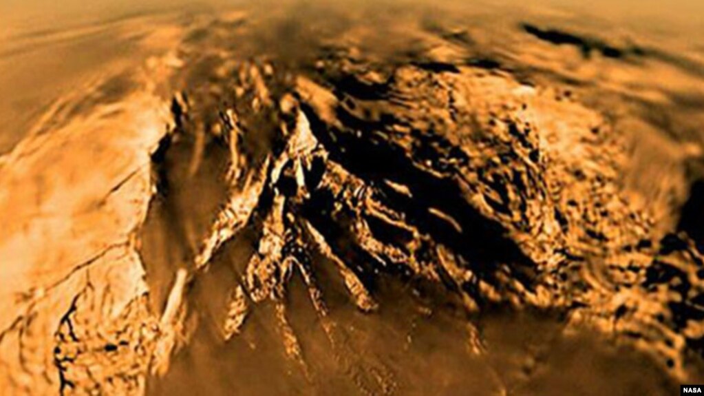 Titan is seen from the Huygens probe as it descended to the surface in 2005.