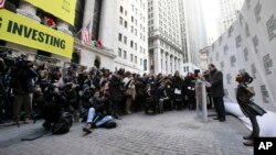 The Fearless Girl statue is unveiled at its new location in front of the New York Stock Exchange, Dec. 10, 2018, in New York. 