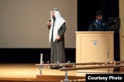 Zico Khayat wears his traditional Arab clothing as he speaks at a Penn State meeting.