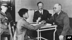 A Chinese immigrant is interrogated at a detention center on Angel Island in San Francisco Bay, Calif., in the 1920's. (AP Photo)