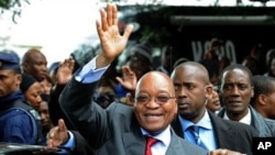 South African President Zuma waves as he arrives to declare his HIV-negative status during launch of the HIV Counselling and Testing Campaign held at Natalspruit Hospital in Katlehong, 25 April 2010