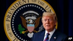 FILE - President Donald Trump arrives for a bill signing ceremony in the South Court Auditorium on the White House campus, May 30, 2018, in Washington, May 30, 2018.