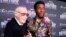 Stan Lee, left, greets cast member Chadwick Boseman at the premiere of "Black Panther" in Los Angeles, Jan. 29, 2018.