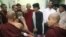 Burmese pro-democracy leader Aung San Suu Kyi visits Buddhist monks, wounded in a police crackdown on activists fighting a Chinese copper mine project, at a hospital in Monywa on Nov. 29, 2012. 