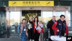 FILE - A group of Russian tourists, likely the first foreign travelers from any country to enter North Korea since the pandemic, arrives at the Pyongyang International Airport in Pyongyang, North Korea, on Feb. 9, 2024. 