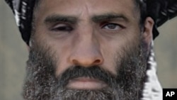 FILE -Taliban leader Mullah Omar.