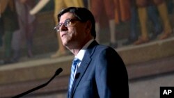 FILE - Treasury Secretary Jacob Lew speaks on redesign of the $10 note at the National Archives in Washington, June 18, 2015. 
