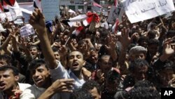 Anti-government protesters shout slogans during a protest demanding the ouster of Yemen's President Ali Abdullah Saleh outside Sana'a University March 1, 2011