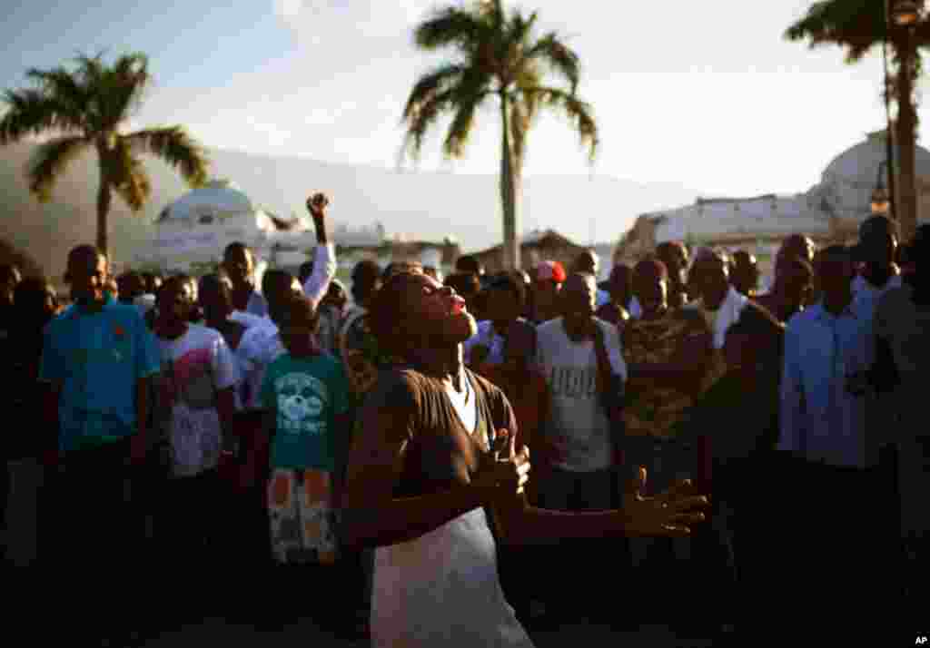 January 12: People cheer as a woman dances in front of the heavily damaged National Palace during a memorial held to commemorate victims of the 2010 earthquake, in downtown Port-au-Prince. Allison Shelley/Reuters