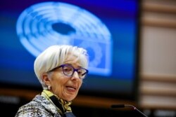 FILE - European Central Bank President Christine Lagarde addresses European lawmakers during a plenary session at the European Parliament in Brussels, Belgium, Feb. 8, 2021.