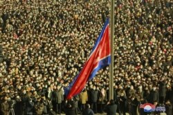 National flag is hoist on New Year's day in Pyongyang in this photo supplied by North Korea's Korean Central News Agency (KCNA) on January 1, 2021.