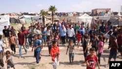 Senior U.N. Coordinator for Humanitarian Action and Reconstruction in Gaza Sigrid Kaag visits a makeshift camp for displaced Palestinians in Mawasi near Khan Yunis in the southern Gaza Strip on Oct. 15, 2024.