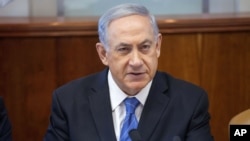 Israel's Prime Minister Benjamin Netanyahu chairs the weekly cabinet meeting in Jerusalem, Aug. 17, 2014. 