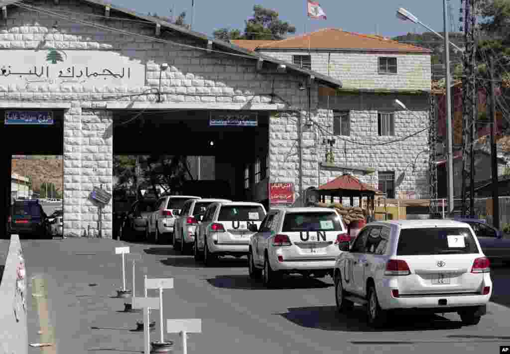 A convoy of inspectors from the Organization for the Prohibition of Chemical Weapons prepares cross into Syria at the Lebanese border crossing point of Masnaa, Oct. 1, 2013.