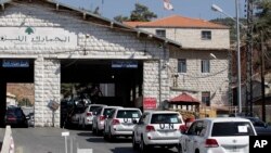 A convoy of inspectors from the Organization for the Prohibition of Chemical Weapons prepares cross into Syria at the Lebanese border crossing point of Masnaa, Oct. 1, 2013.