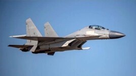 In this undated file photo released by the Taiwan Ministry of Defense, a Chinese PLA J-16 fighter jet flies in an undisclosed location. (Taiwan Ministry of Defense via AP, File)