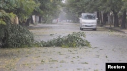 FILE - Fallen branches are seen on a street as Storm Freddy is due to hit Mozambique again, in Quelimane, Zambezia, Mozambique, March 11, 2023, in this screengrab obtained from a video.