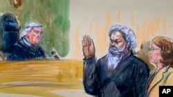 FILE - This artist's rendering shows U.S. Magistrate Judge John Facciola swearing in Ahmed Abu Khatallah, wearing a headphone, as his attorney Michelle Peterson looks on during a hearing at U.S. District Court in Washington, June 28, 2014.