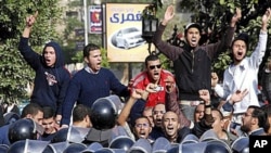 Angry Egyptian protestors shout anti-government slogans during a third straight day of demonstrations, in Suez, Egypt, January 27, 2011