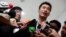 Thanathorn Juangroongruangkit, founder of Thailand's Future Forward Party, talks to journalists before leaving Technology Crime Suppression Division in Bangkok, Thailand, Sept. 17, 2018.