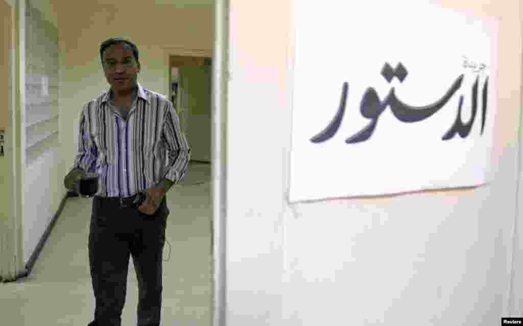 Islam Afifi, editor-in-chief of the Al-Dostour opposition newspaper, is seen in his office in Cairo August 27, 2012. 