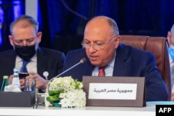 Egypt's Foreign Minister Sameh Shoukry addresses his Arab counterparts during a consultative meeting in the Qatari capital Doha, June 15, 2021.