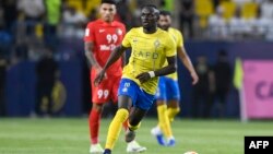 FILE — Al-Nassr's Senegalese Forward Sadio Mane dribbles the ball during the AFC Champions League playoff against Shabab Al-Ahli in Riyadh, Aug. 22, 2023. 