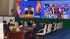 In this photo provided by the An Khoun Sam Aun/National Television of Cambodia, Cambodian Prime Minister, upper, joins an online meeting of the ASEAN-China special summit at Peace Palace in Phnom Penh, Cambodia, Nov. 22, 2021.