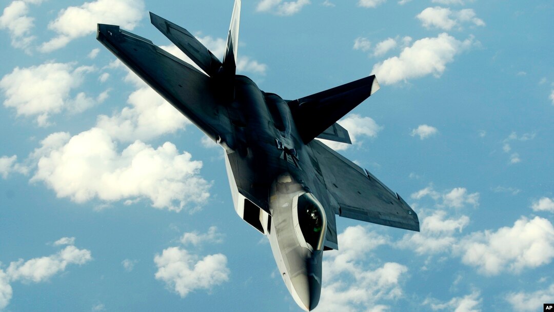 FILE - This U.S. Air Force photo shows an F-22A Raptor returning to a mission after receiving fuel from a KC-135T Stratotanker aircraft Jan. 23, 2009, at Kadena Air Base in Japan. 